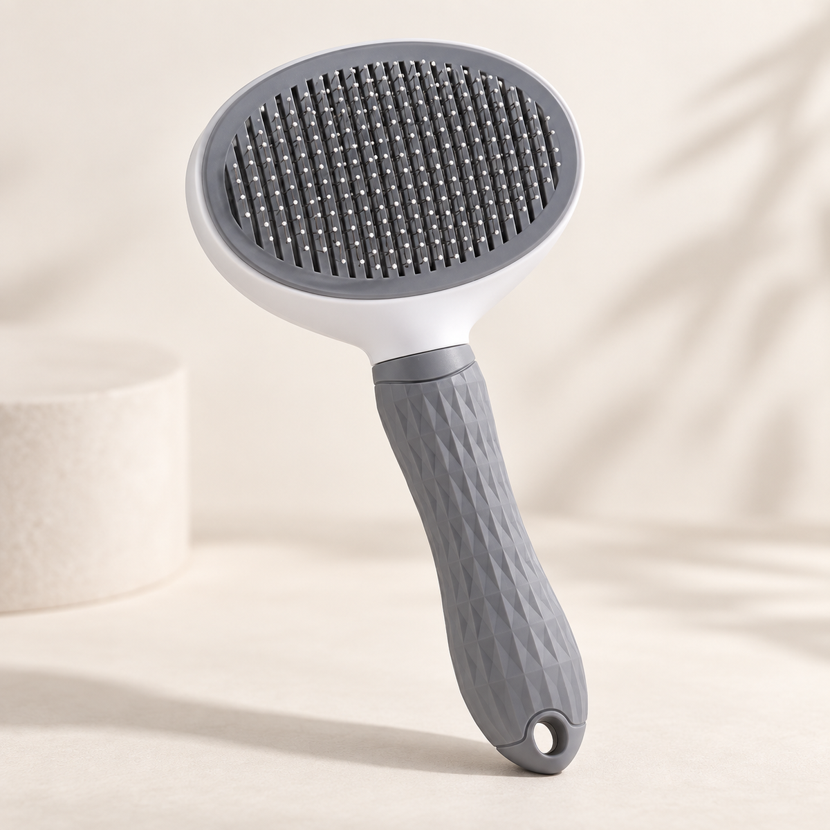 Self-cleaning pet grooming brush